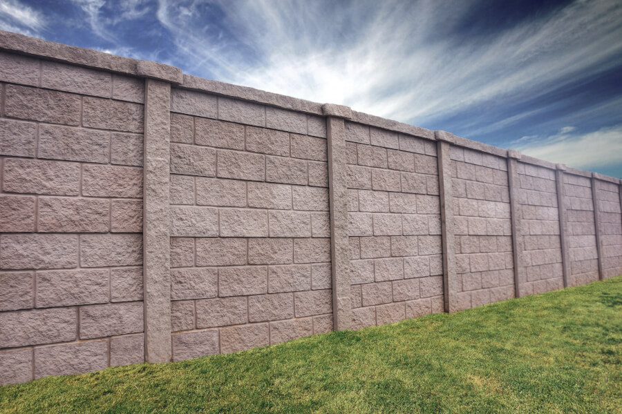 A Precast Concrete Block Wall Fence surrounding the perimeter of a property.