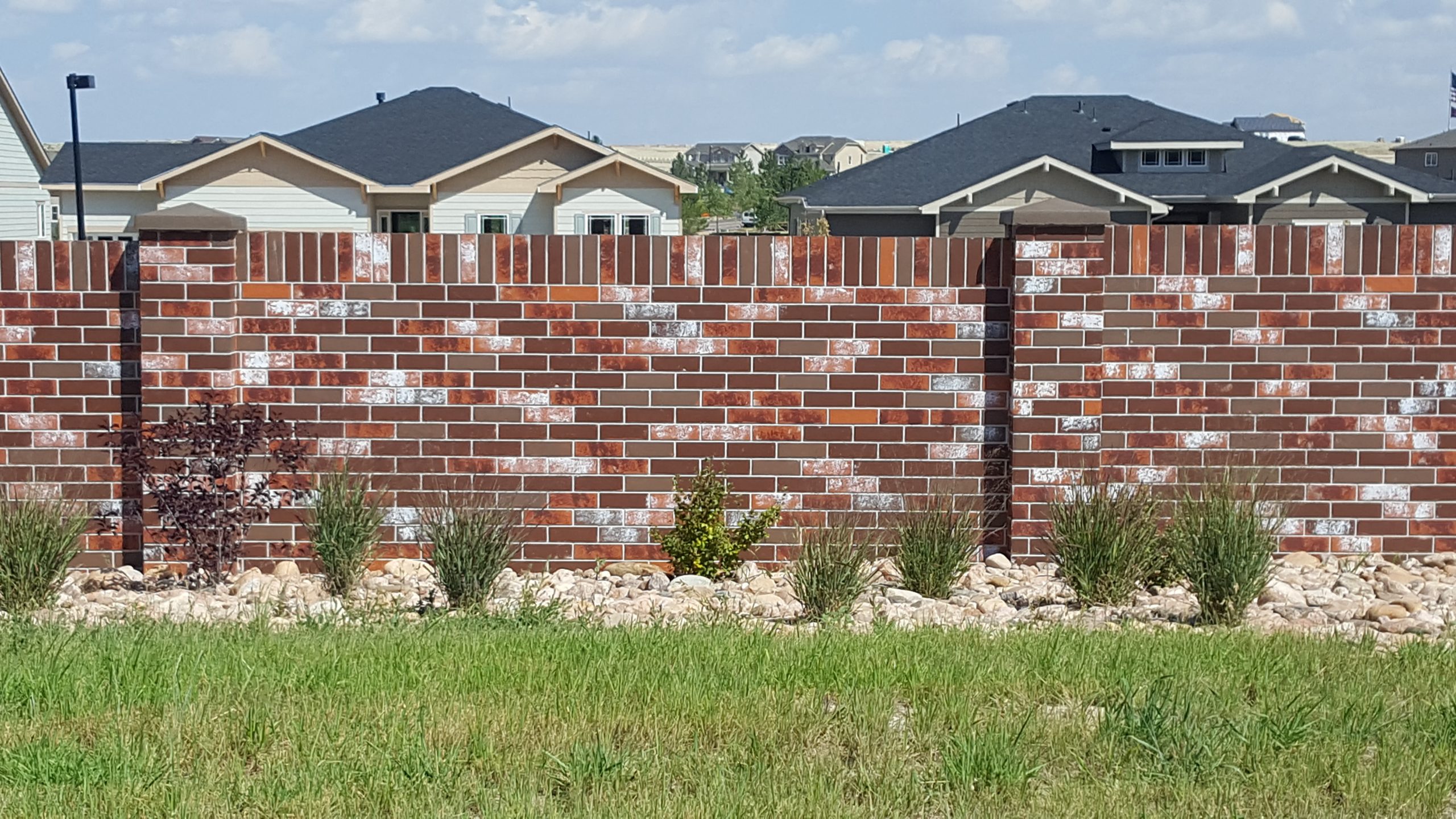 brick precast fencing outside of a residential home