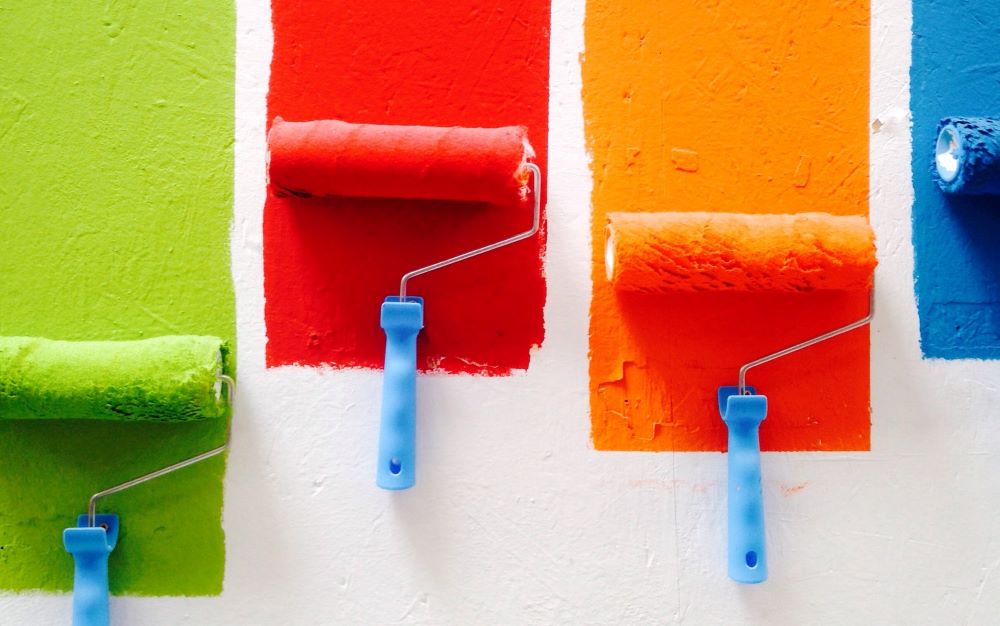 Paint rollers on a wall